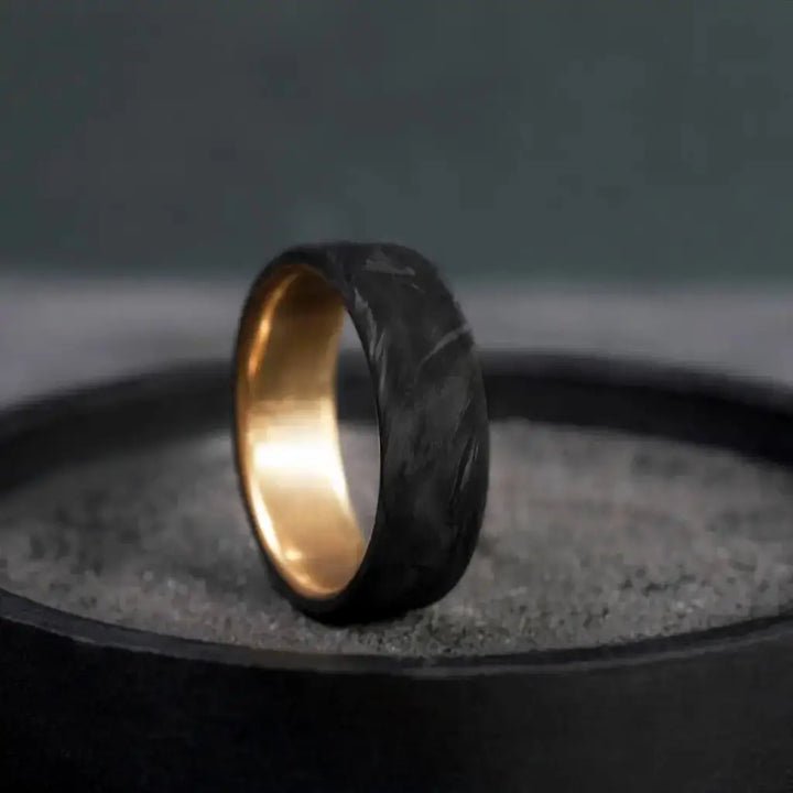 Carbon Fiber Ring with Brass Core.