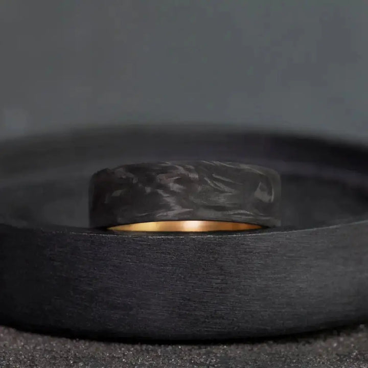 Carbon Fiber Ring with Brass Core.