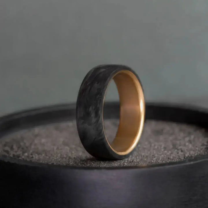 Carbon Fiber Ring with Brass Core.