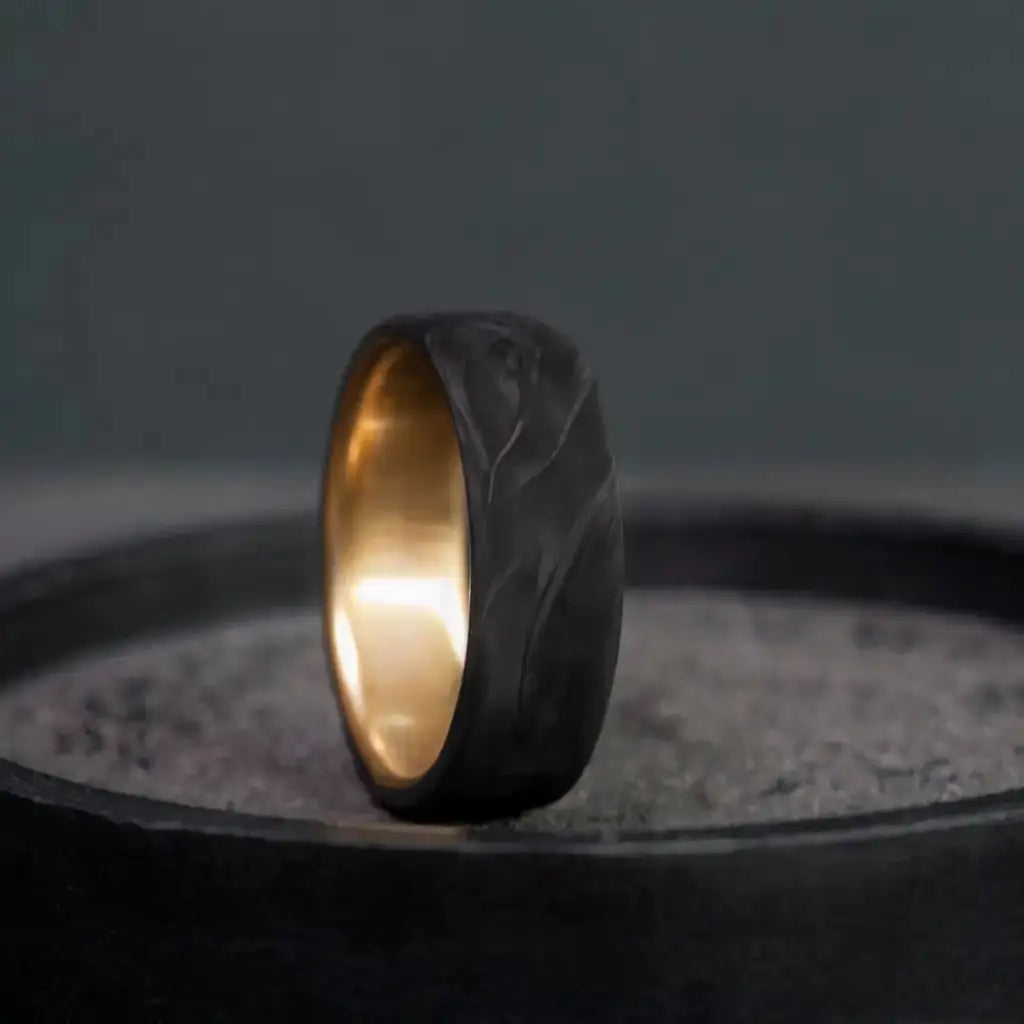 Carbon Fiber Ring with Brass Core.