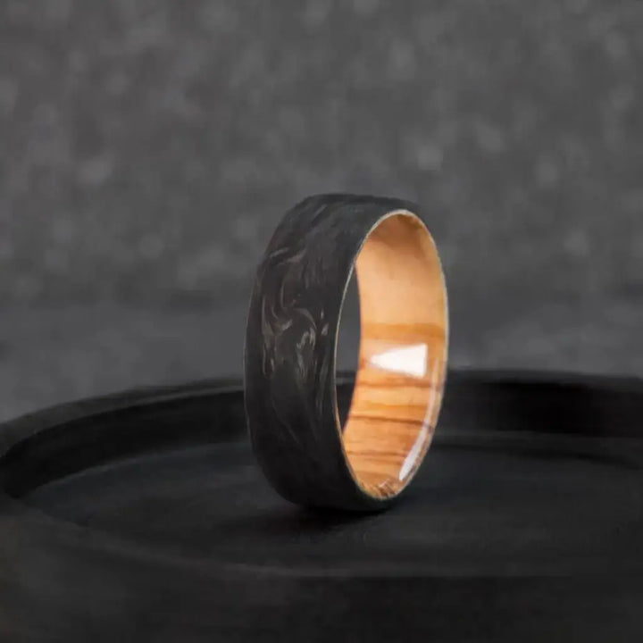 Handmade Carbon Fiber and Olive Wood Wedding Ring.