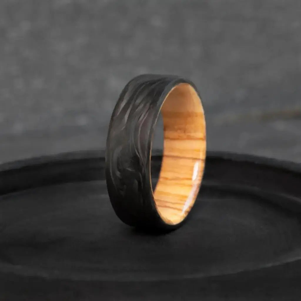 Handmade Carbon Fiber and Olive Wood Wedding Ring.