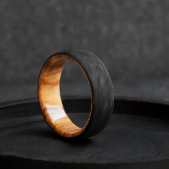 Handmade Carbon Fiber and Olive Wood Wedding Ring.