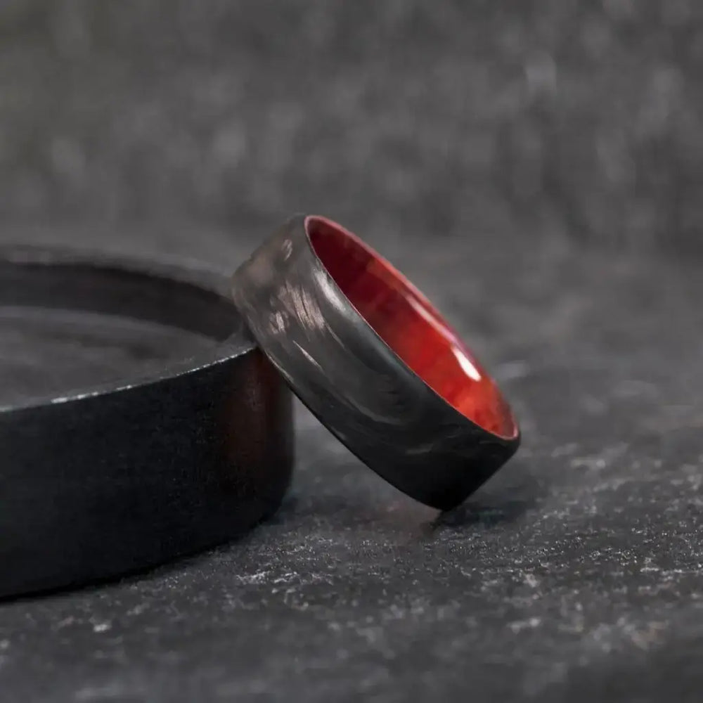 Forged Carbon Fiber and Redheart Wood Wedding Ring.