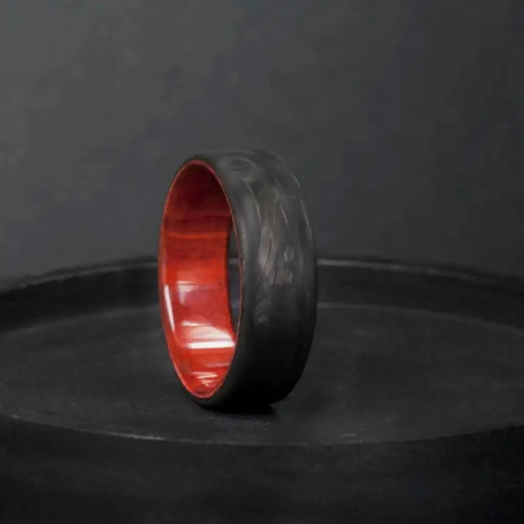 Forged Carbon Fiber and Redheart Wood Wedding Ring.